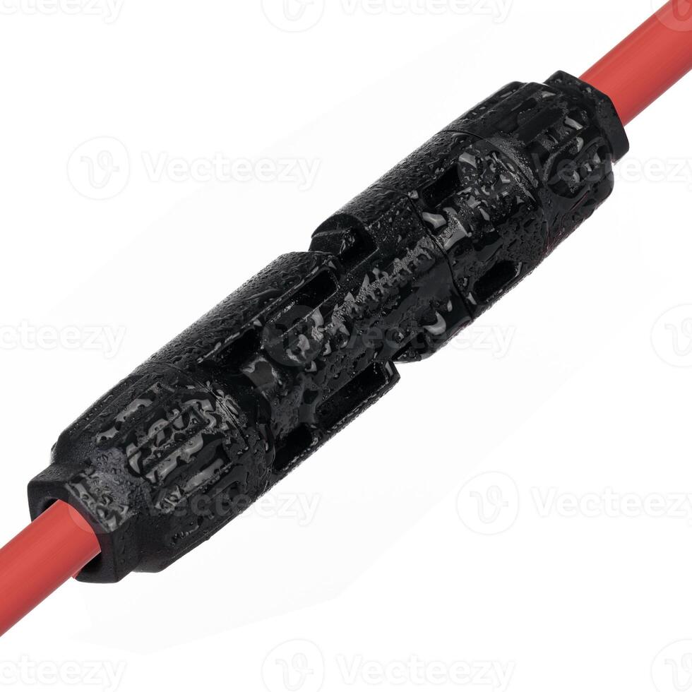 Solar Panel MC4 Connector Detail. Waterproof Connector Attached to Red Cable. photo