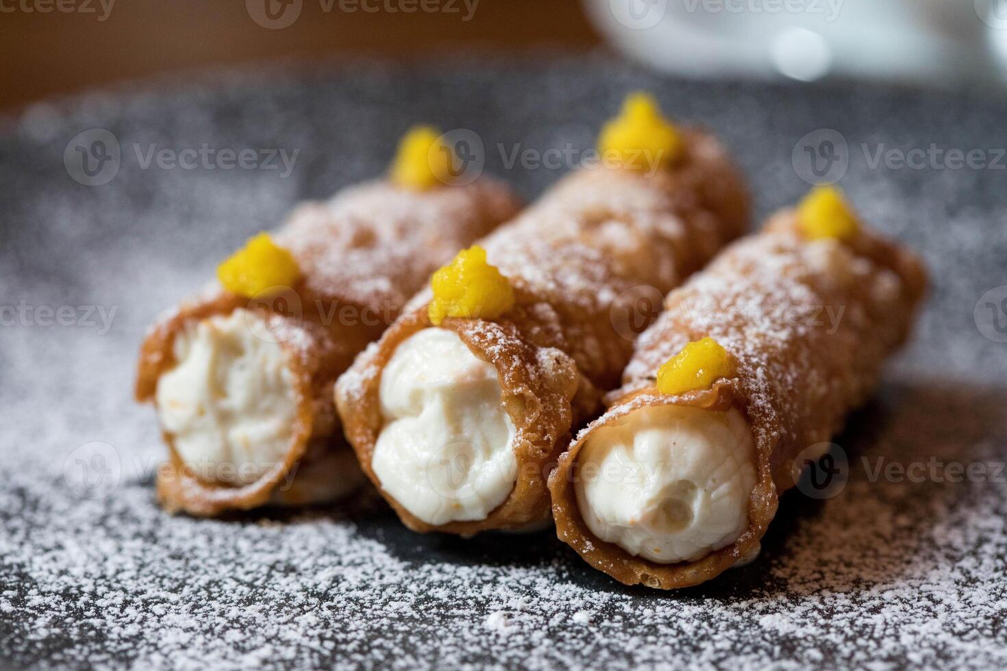 Dessert of puff pastry with cottage cheese and mango. Selective focus. photo