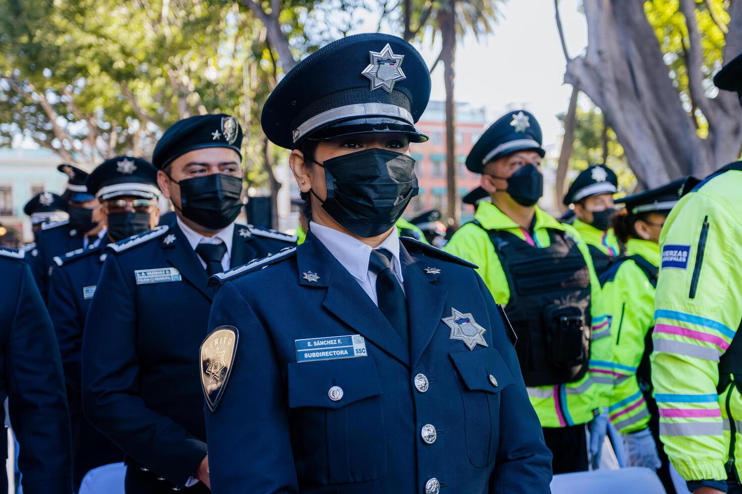Puebla, Mexico, 2024 - Deputy director of the secretary of citizen security with the Municipal Police logo emblem in uniform, maintains public order in the streets. photo