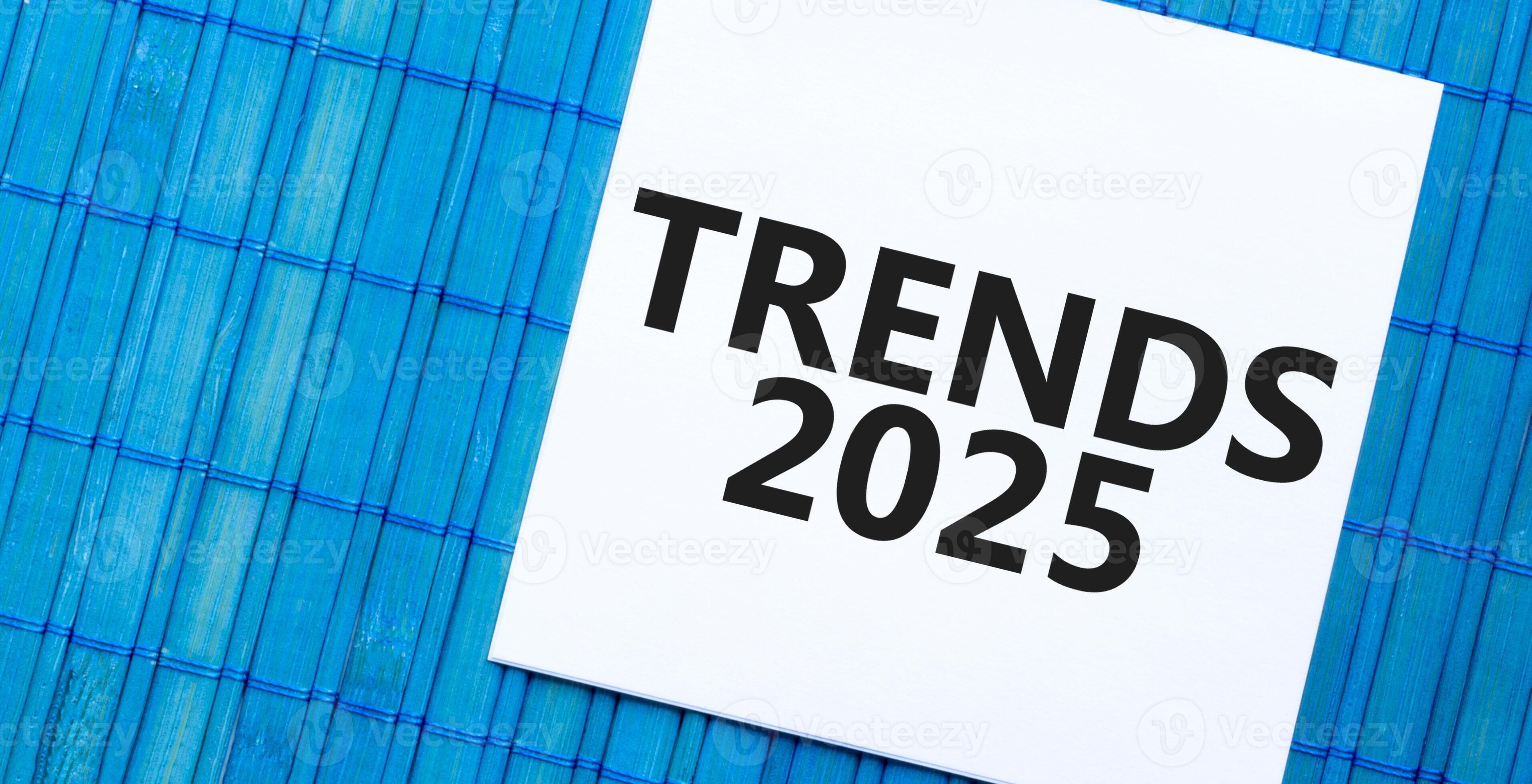 TRENDS 2025 note on blue bamboo background. Business and forecasting concept 41331915 Stock