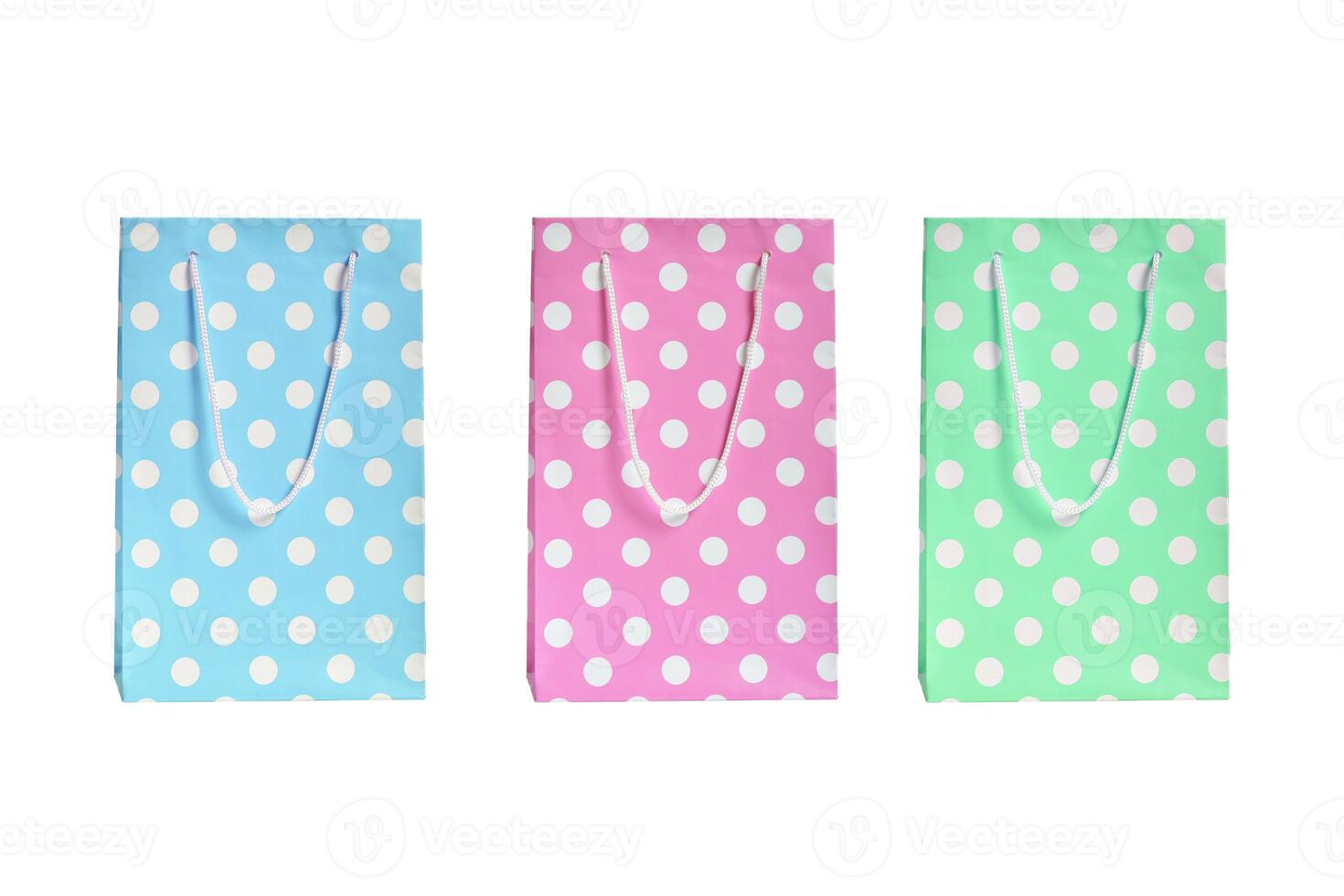 gift bags with handles blue pink and green on a white background photo