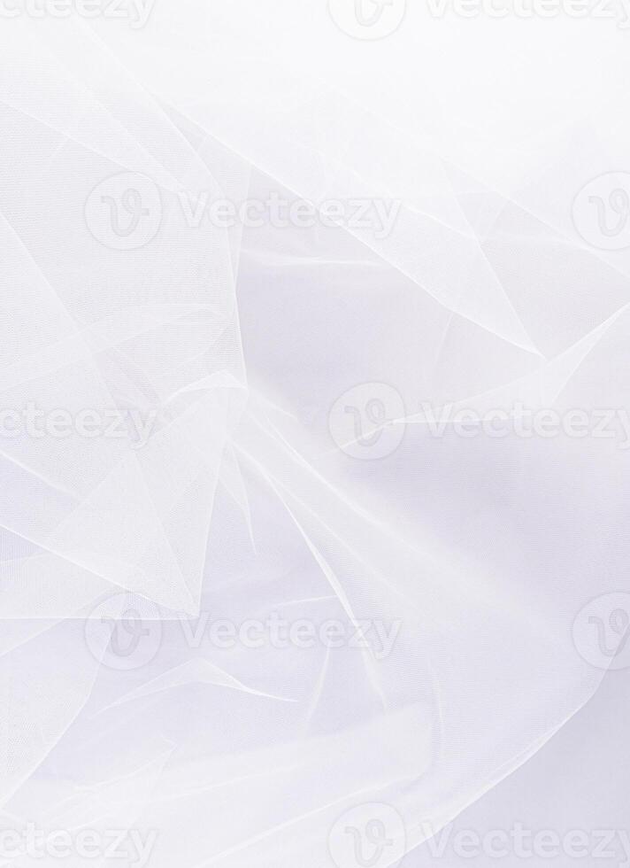 Elegant vertical background of the bridal classic veil in snow-white color. Beautiful folds of fabric. A copy space. layout. design. Wedding concept. photo
