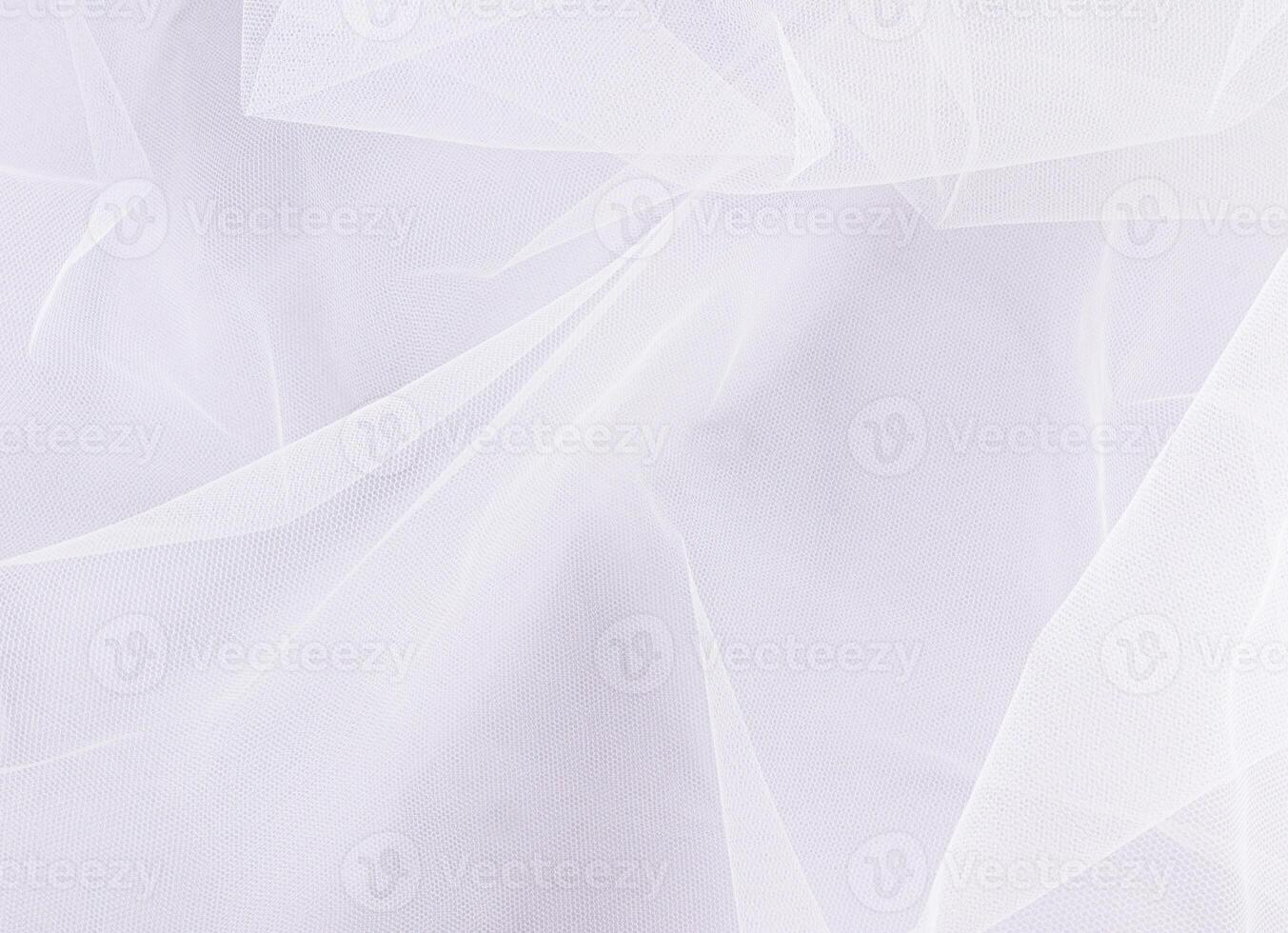 Chic white wedding tulle, veil for layout or design. delicate folds of fabric. Classic tulle mesh. A copy of the space. Wedding background. photo