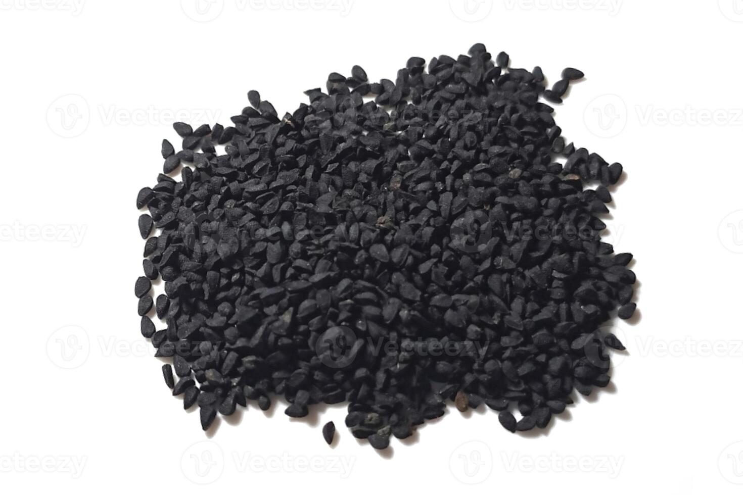 Black cumin seeds pile isolated on white background photo
