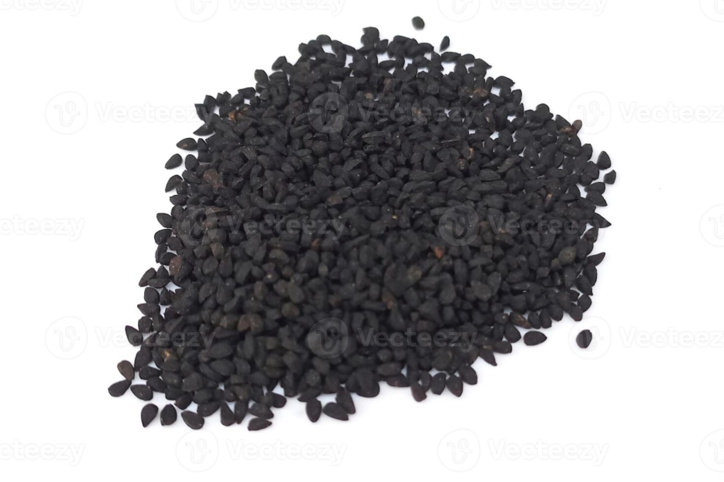 Black cumin seeds pile isolated on white background photo