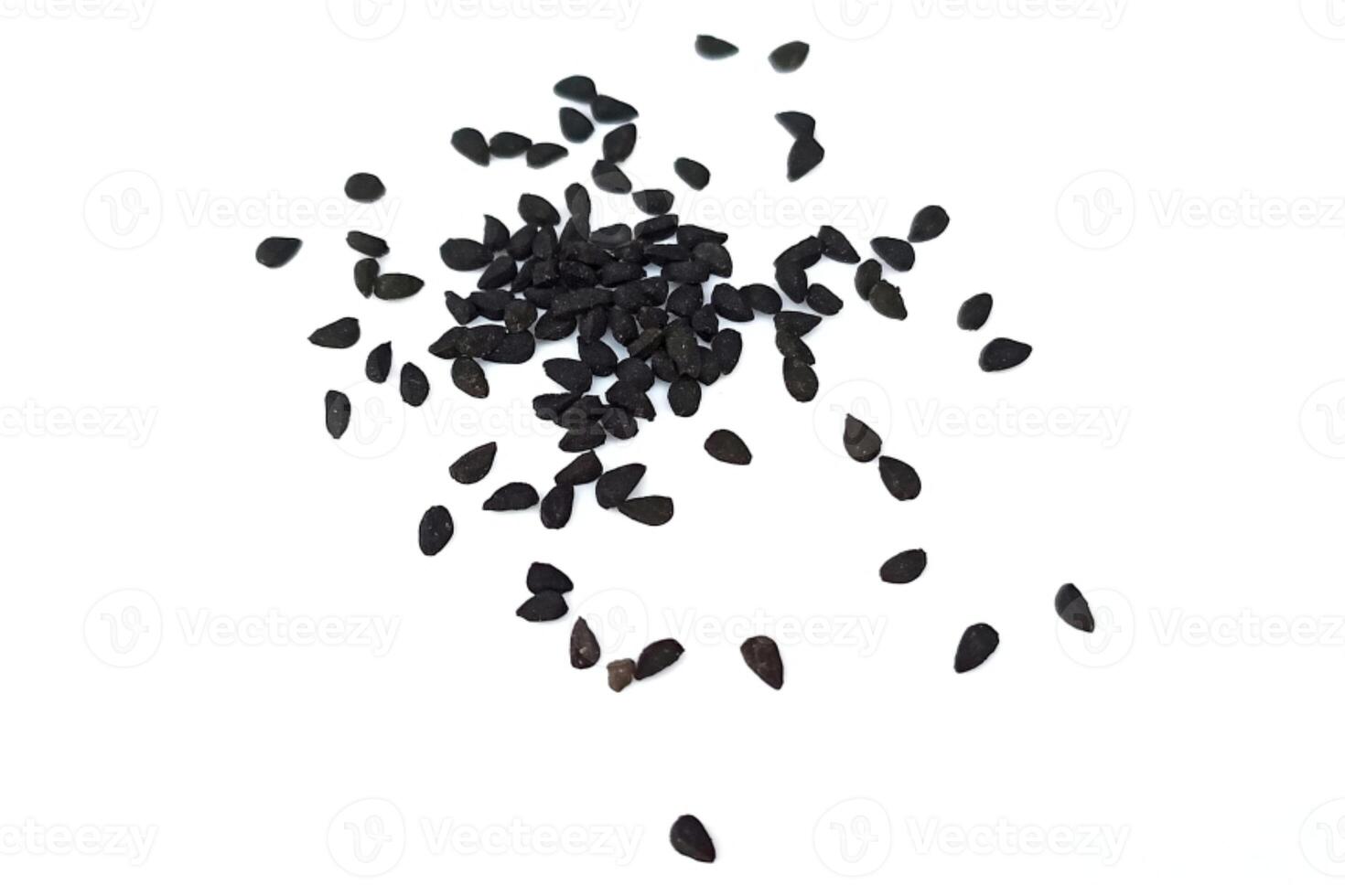 Black cumin seeds pile isolated on white background photo