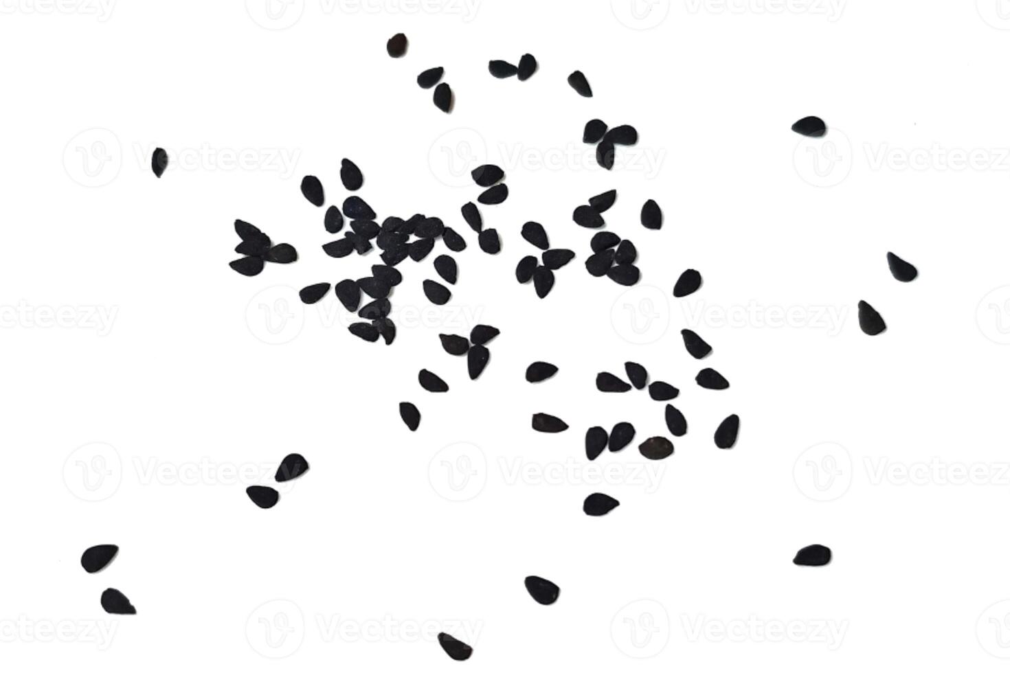 Black cumin seeds pile isolated on white background photo