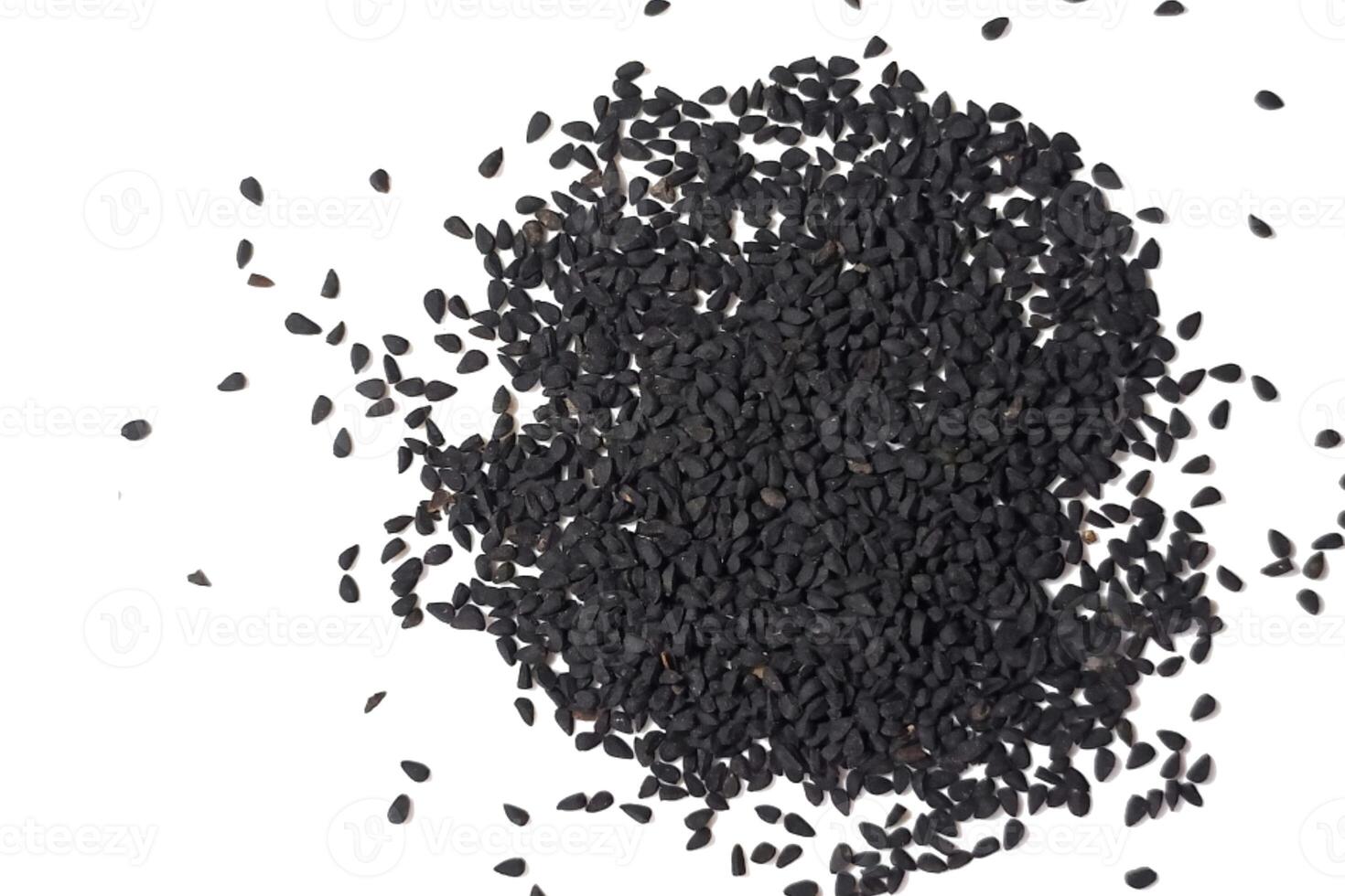 Black cumin seeds pile isolated on white background photo