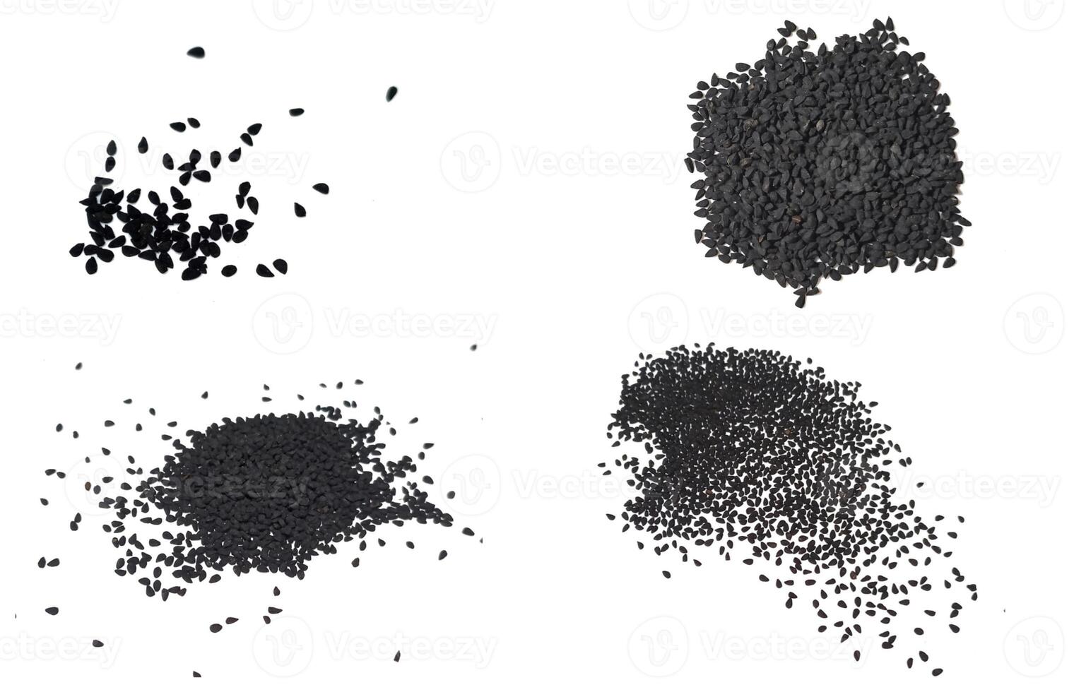 Black cumin seeds pile isolated on white background photo