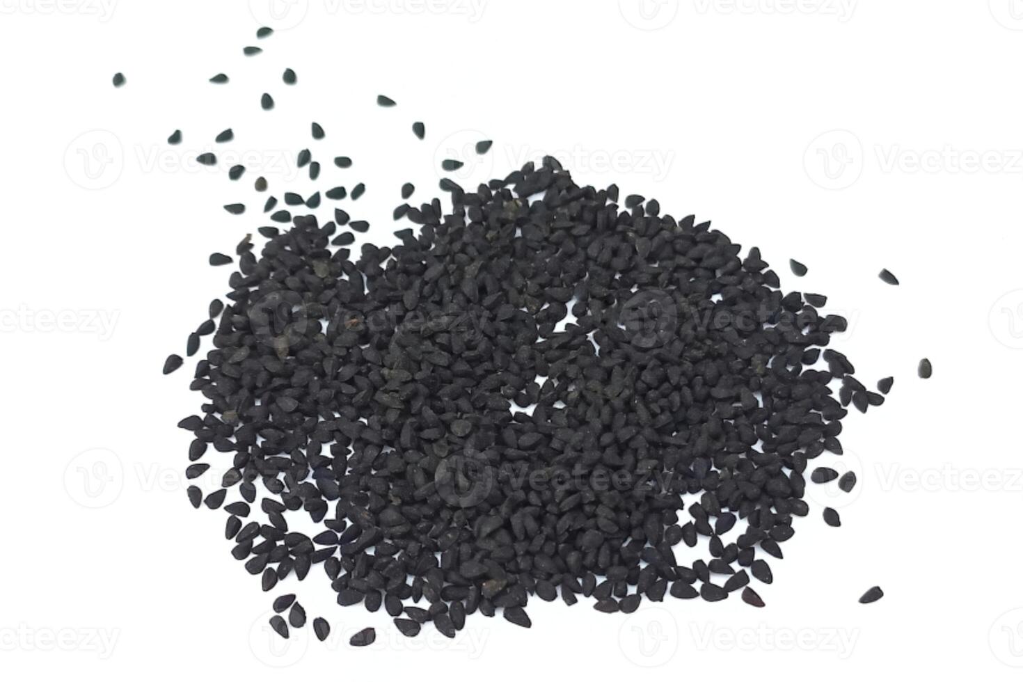 Black cumin seeds pile isolated on white background photo