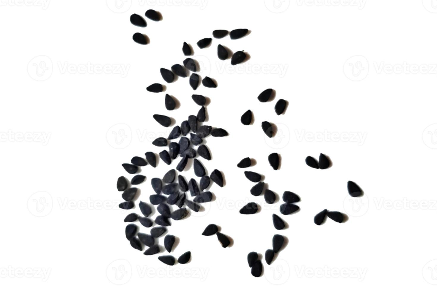 Black cumin seeds pile isolated on white background photo