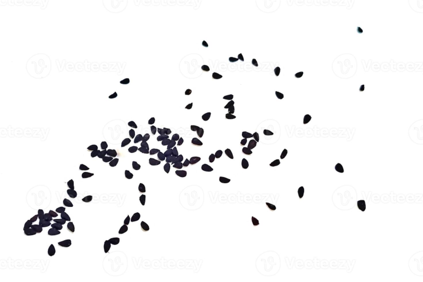 Black cumin seeds pile isolated on white background photo