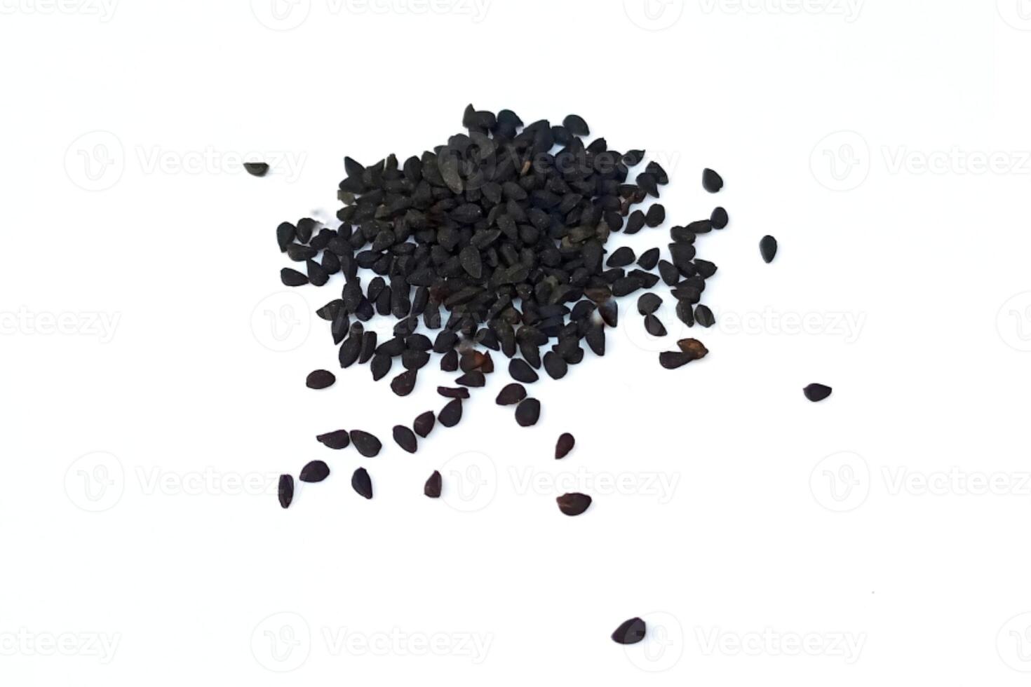 Black cumin seeds pile isolated on white background photo