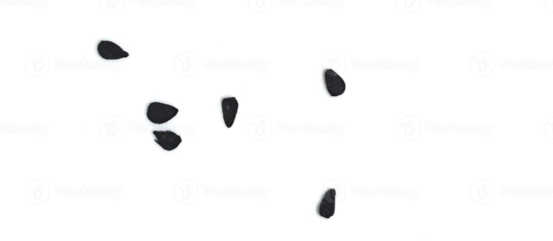 Black cumin seeds pile isolated on white background photo