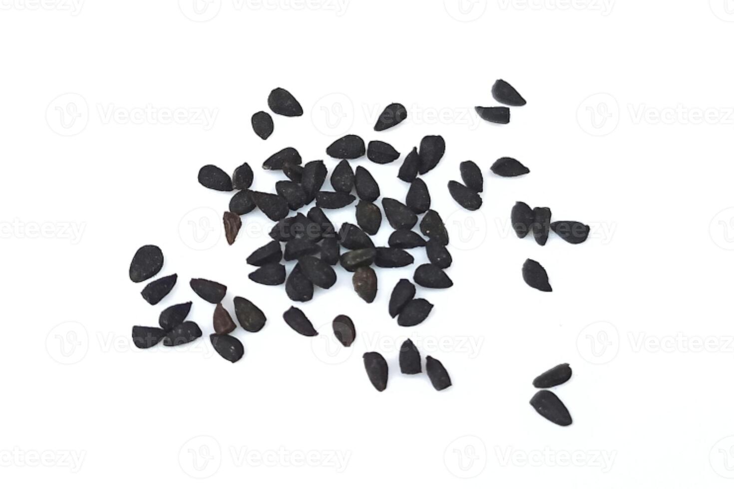 Black cumin seeds pile isolated on white background photo