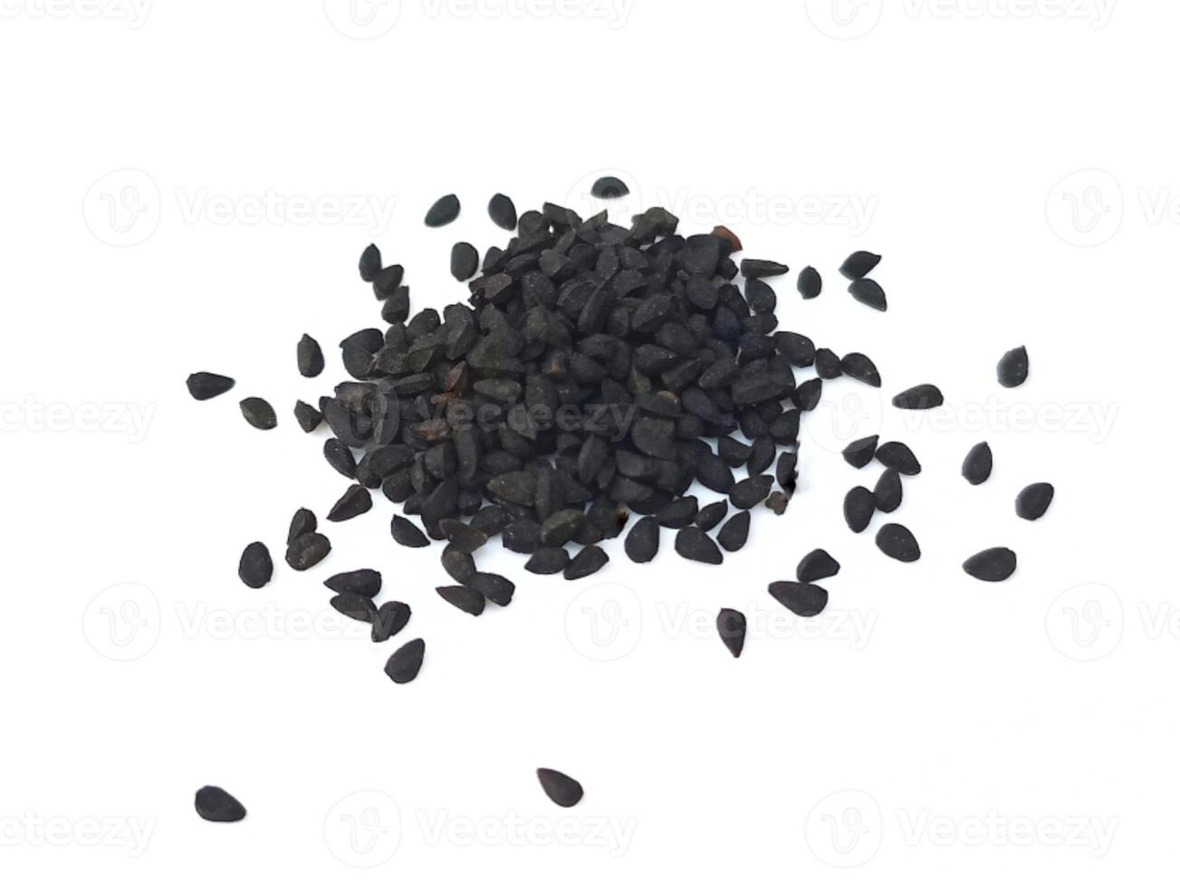 Black cumin seeds pile isolated on white background photo