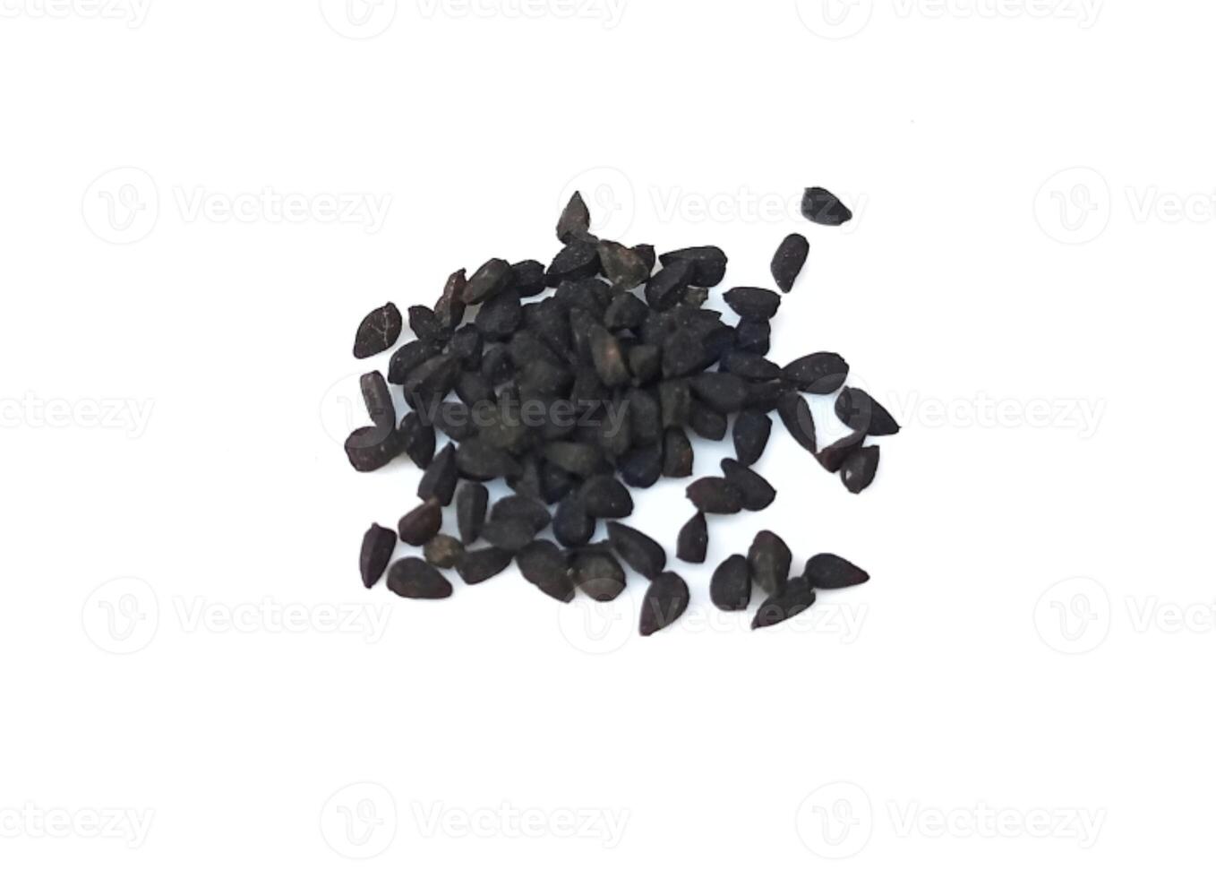 Black cumin seeds pile isolated on white background photo