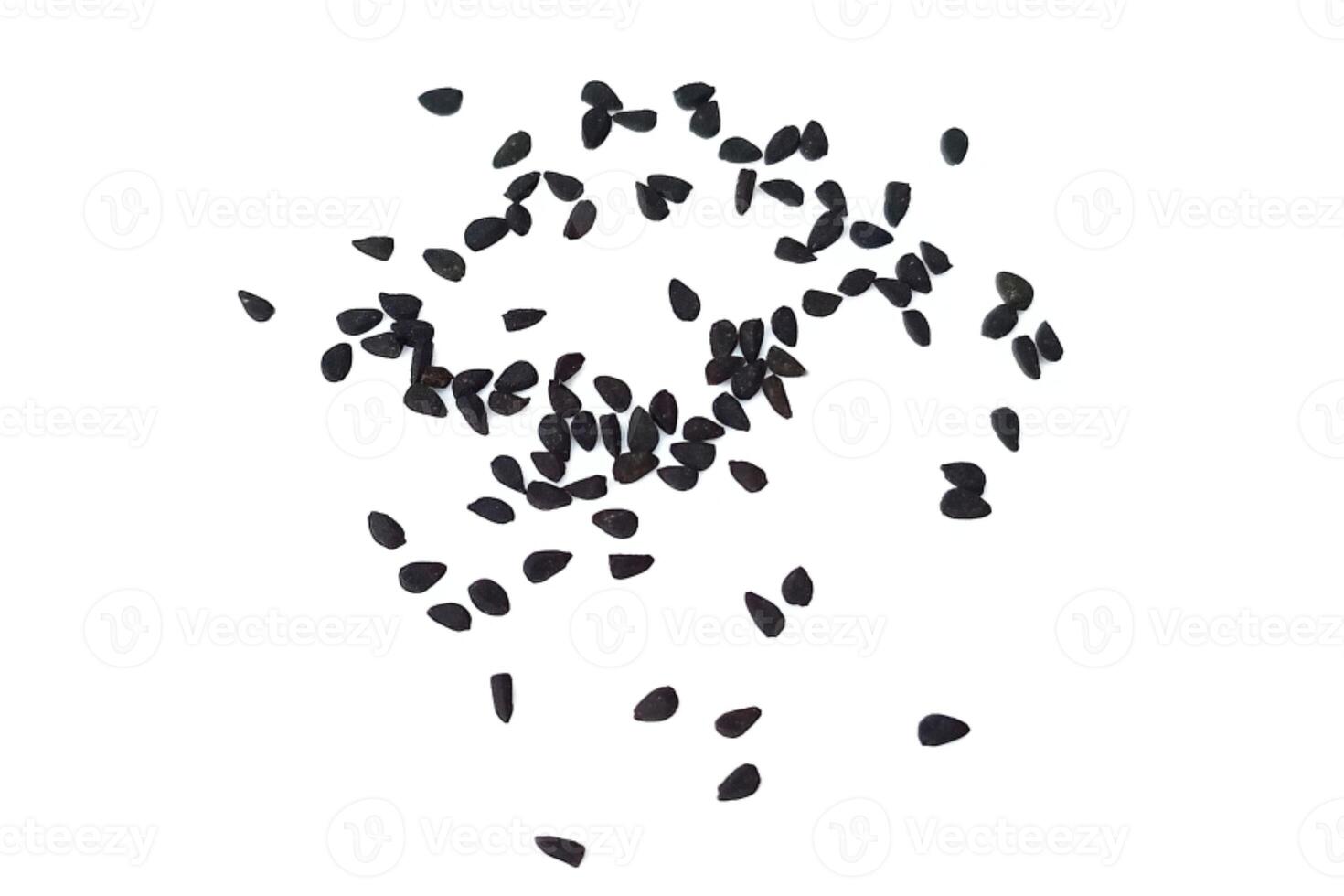 Black cumin seeds pile isolated on white background photo