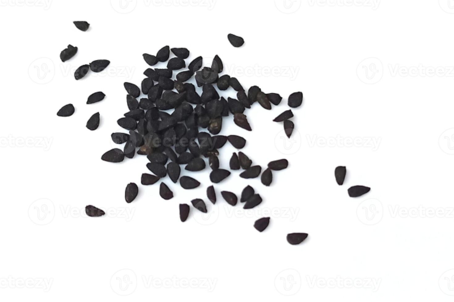 Black cumin seeds pile isolated on white background photo