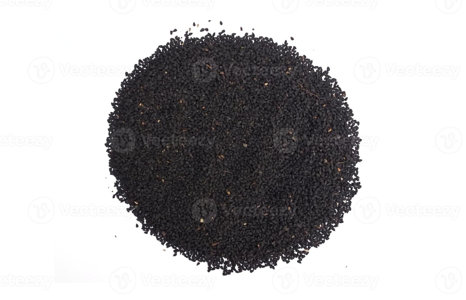 Black cumin seeds pile isolated on white background photo