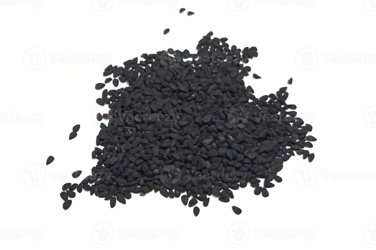 Black cumin seeds pile isolated on white background photo