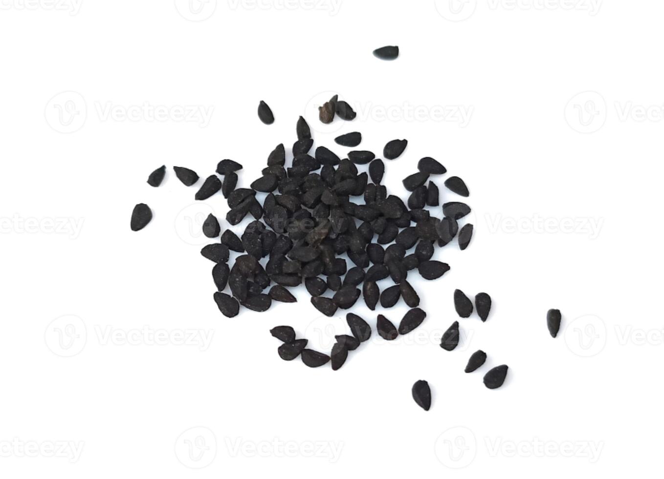 Black cumin seeds pile isolated on white background photo