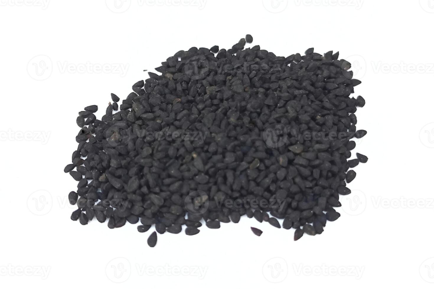 Black cumin seeds pile isolated on white background photo