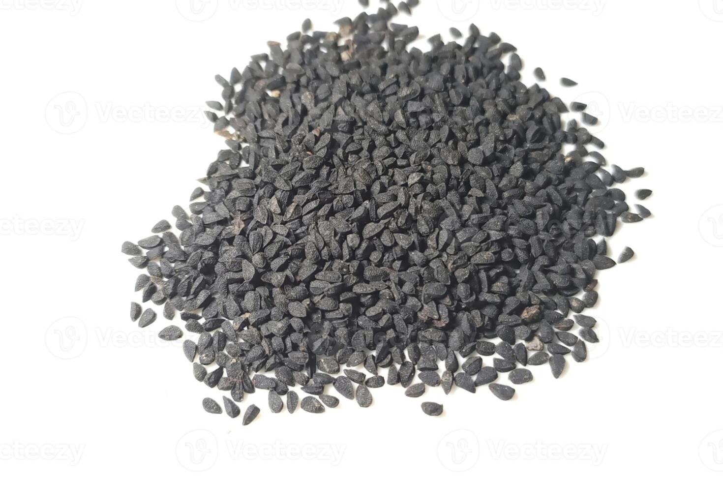 Black cumin seeds pile isolated on white background photo