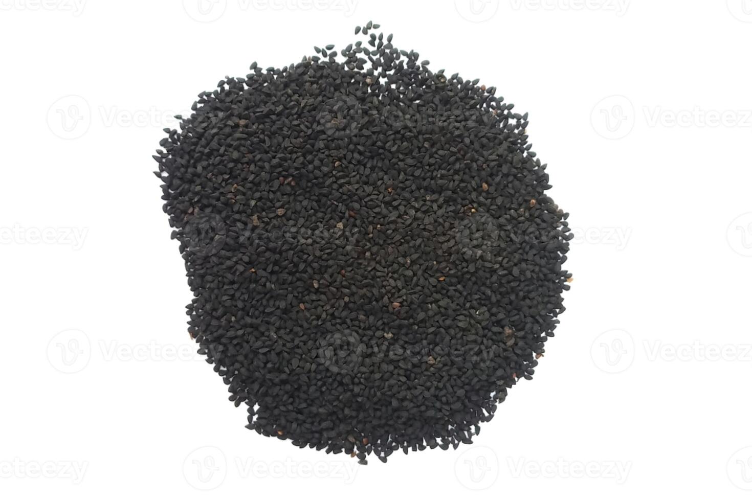 Black cumin seeds pile isolated on white background photo