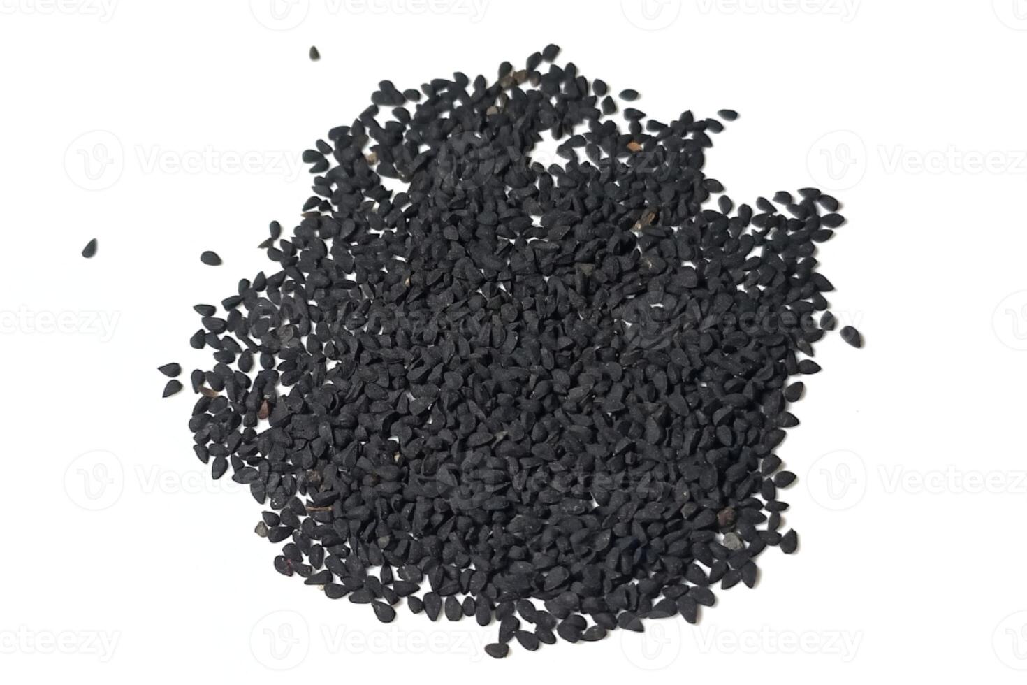 Black cumin seeds pile isolated on white background photo