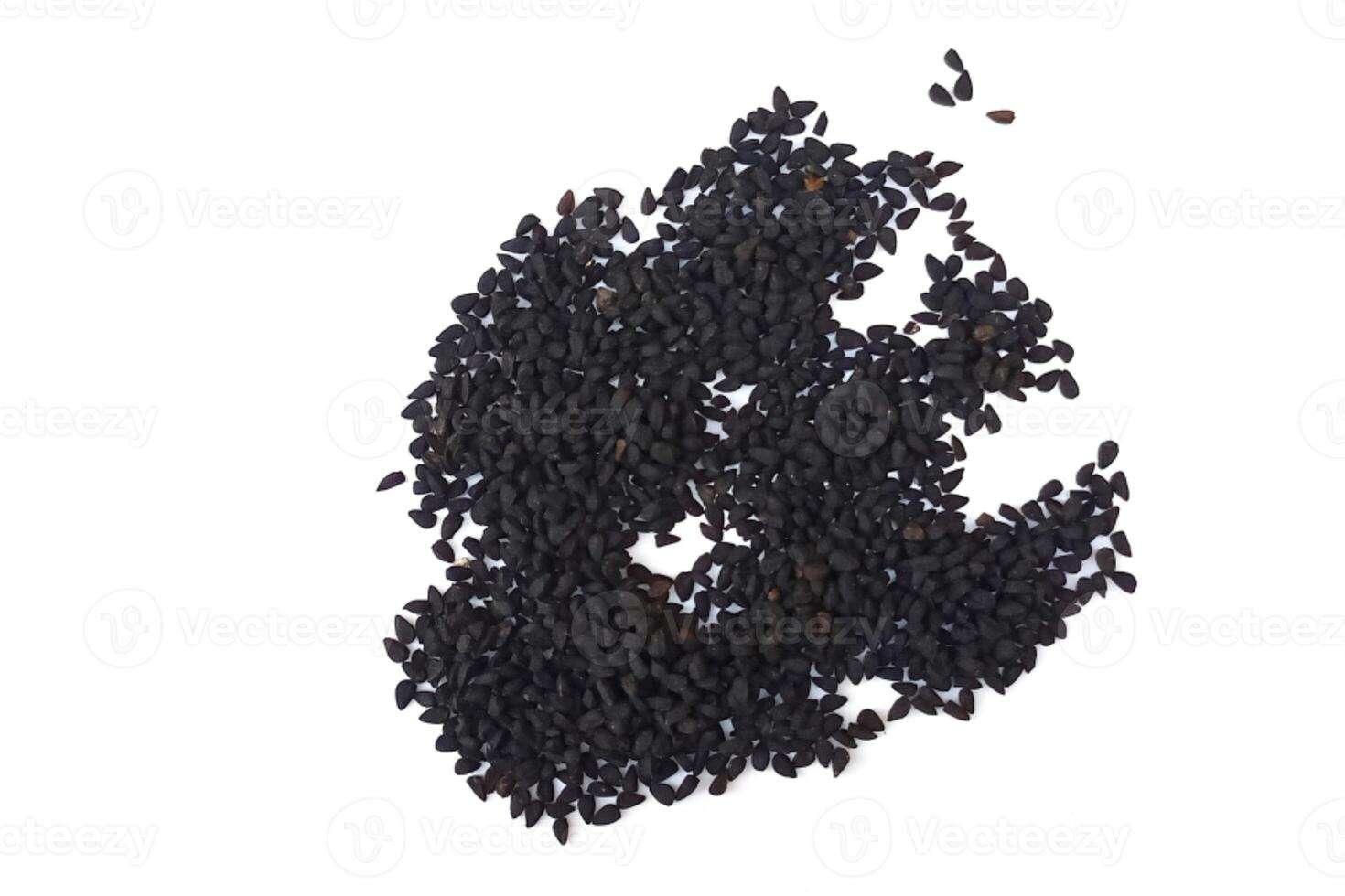 Black cumin seeds pile isolated on white background photo