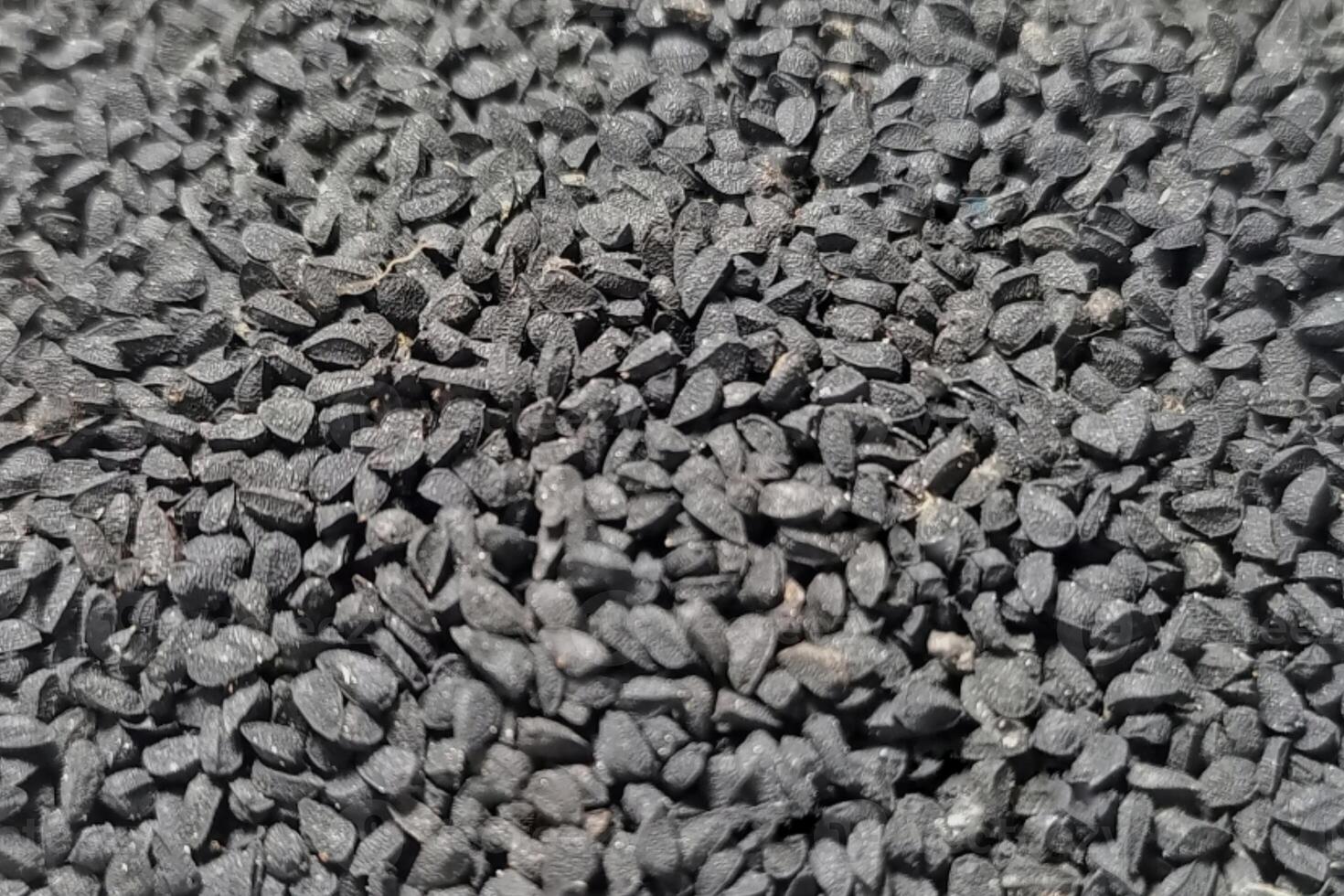 Black cumin seeds background texture photo