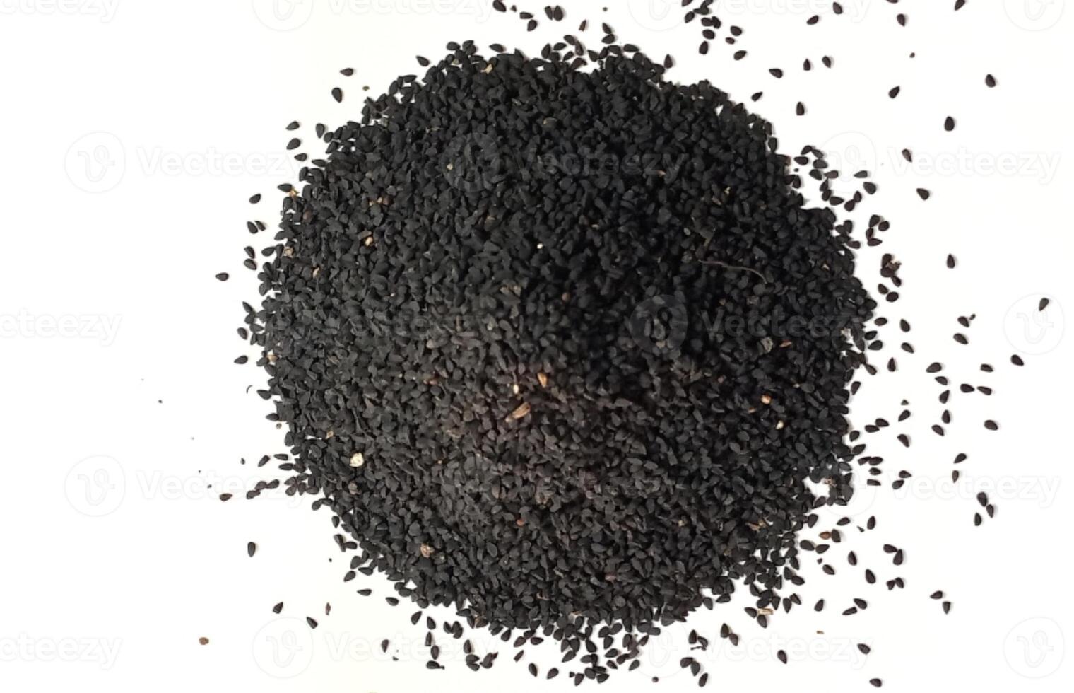 Black cumin seeds pile isolated on white background photo