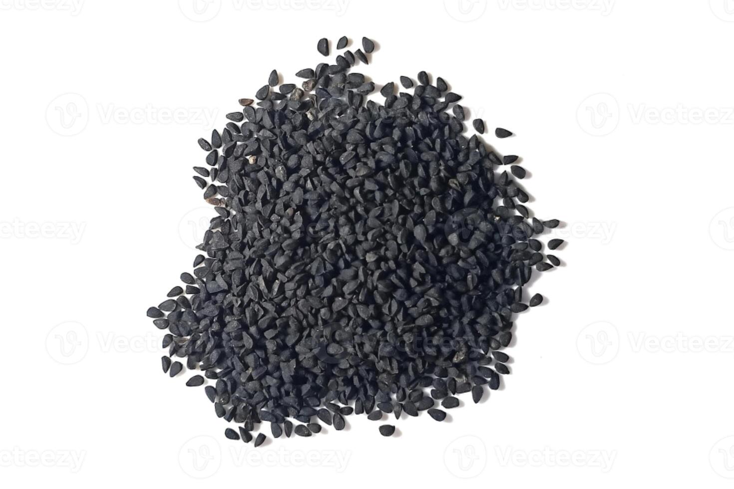 Black cumin seeds pile isolated on white background photo
