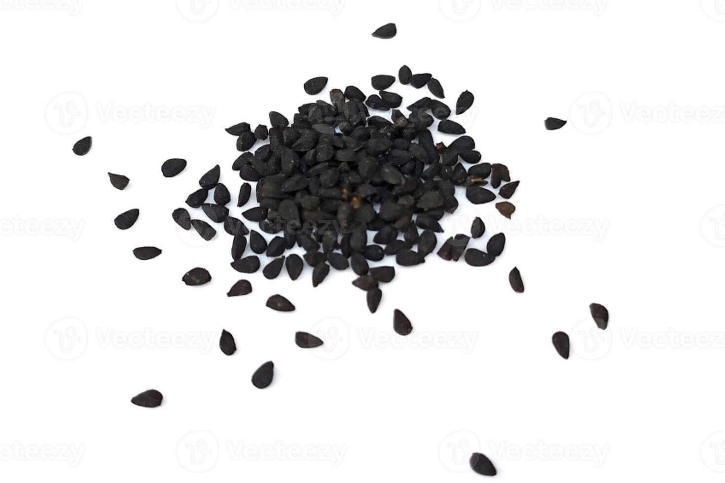 Black cumin seeds pile isolated on white background photo