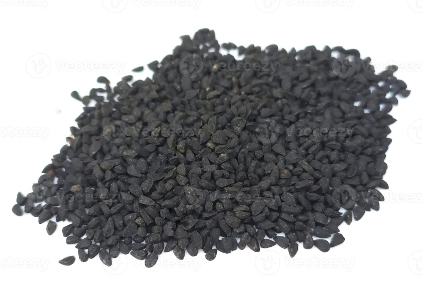 Black cumin seeds pile isolated on white background photo