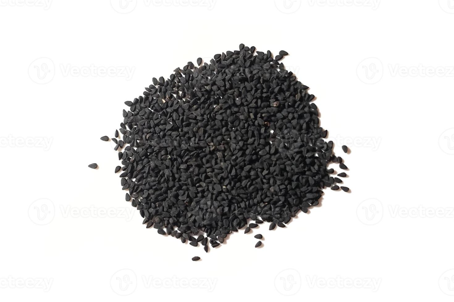 Black cumin seeds pile isolated on white background photo