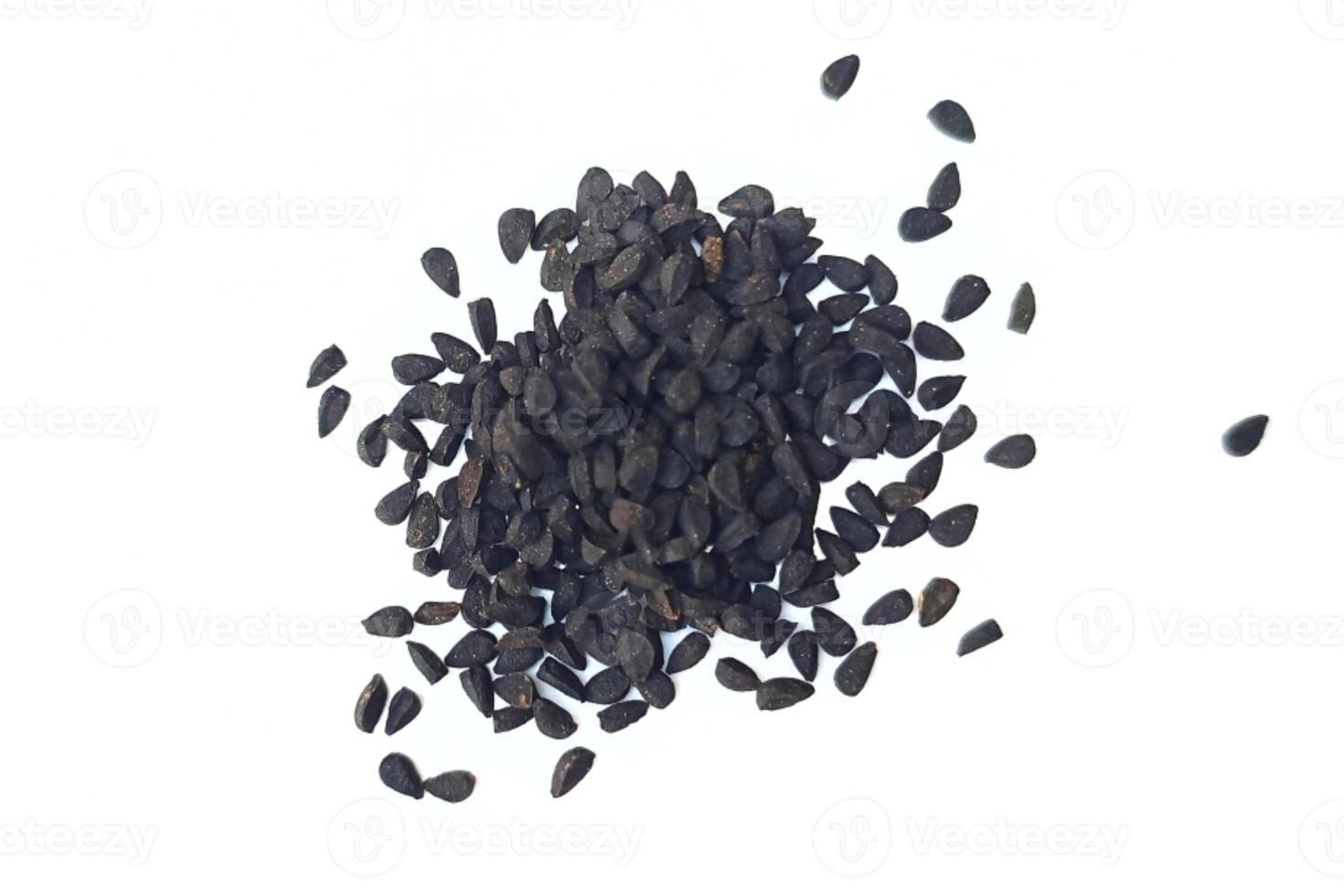 Black cumin seeds pile isolated on white background photo