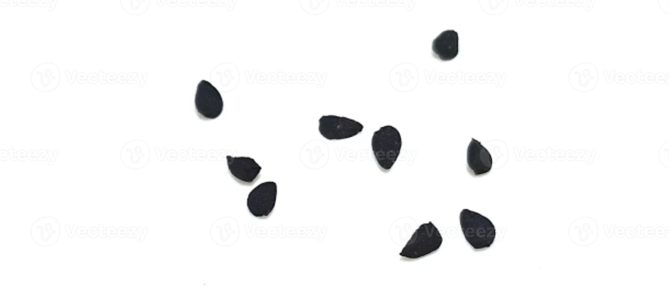 Black cumin seeds pile isolated on white background photo