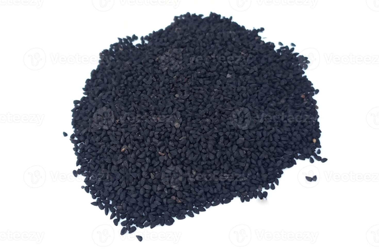 Black cumin seeds pile isolated on white background photo