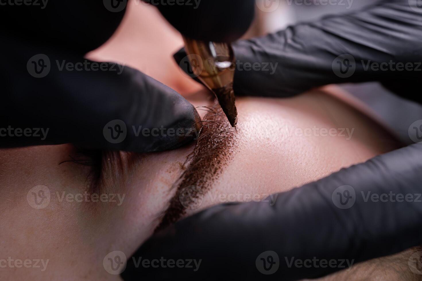 Macro photo of eyebrows with applied permanent makeup in pixel technique. PMU Procedure, Permanent Eyebrow Makeup.