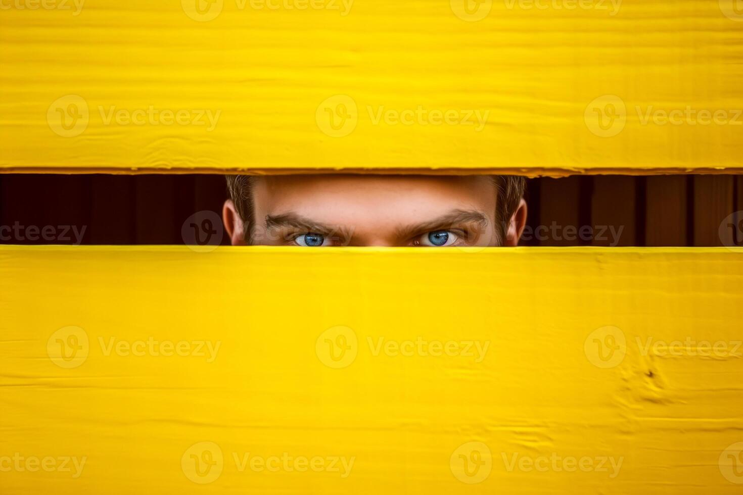 AI generated Young man looking out through the crack of the wooden yellow door photo