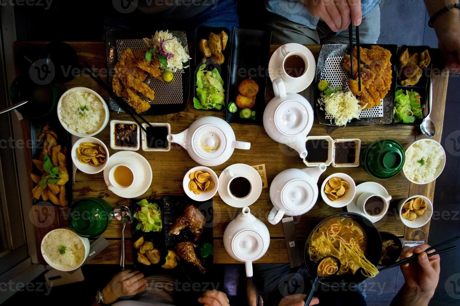 Top view of a group of people having breakfast in a restaurant. photo
