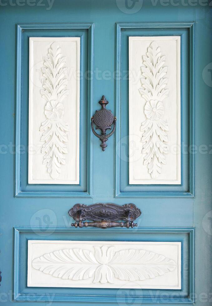 Ornate Blue Door with Traditional Carvings photo