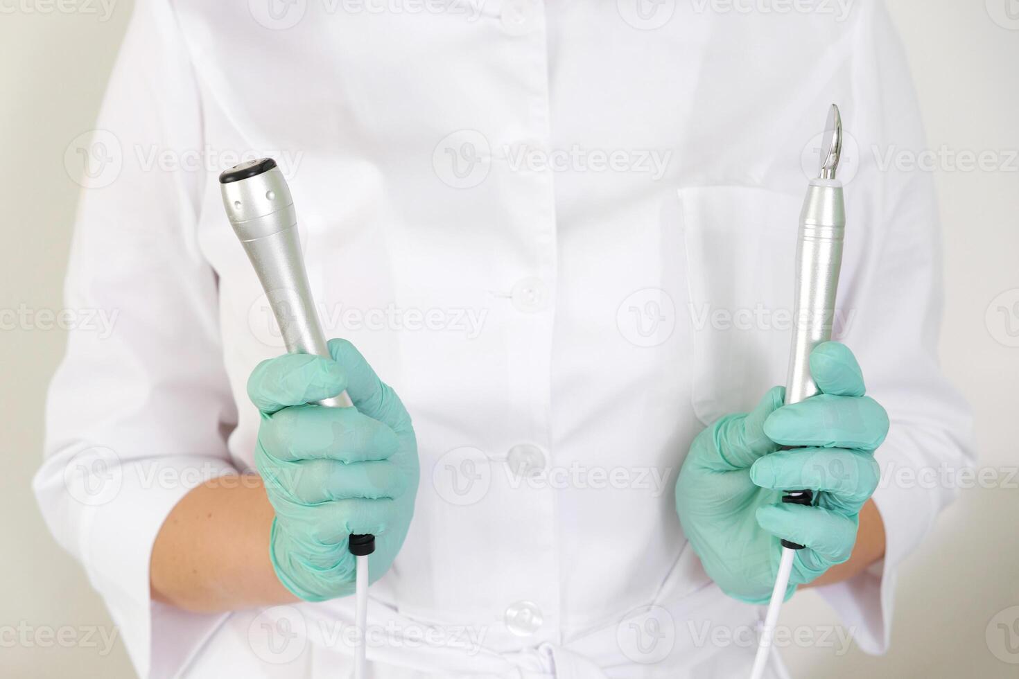 Cosmetologist Holding Electroporation and RF Lifting Devices photo