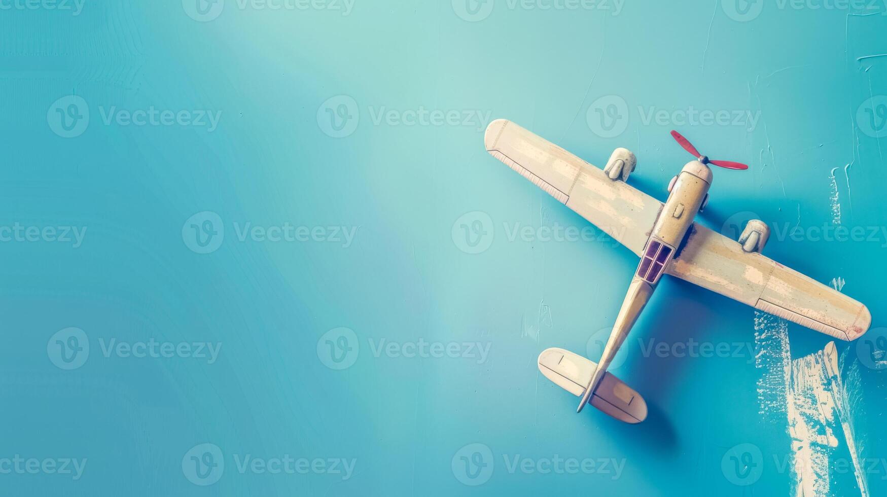 AI Generated Vintage toy airplane on blue background photo