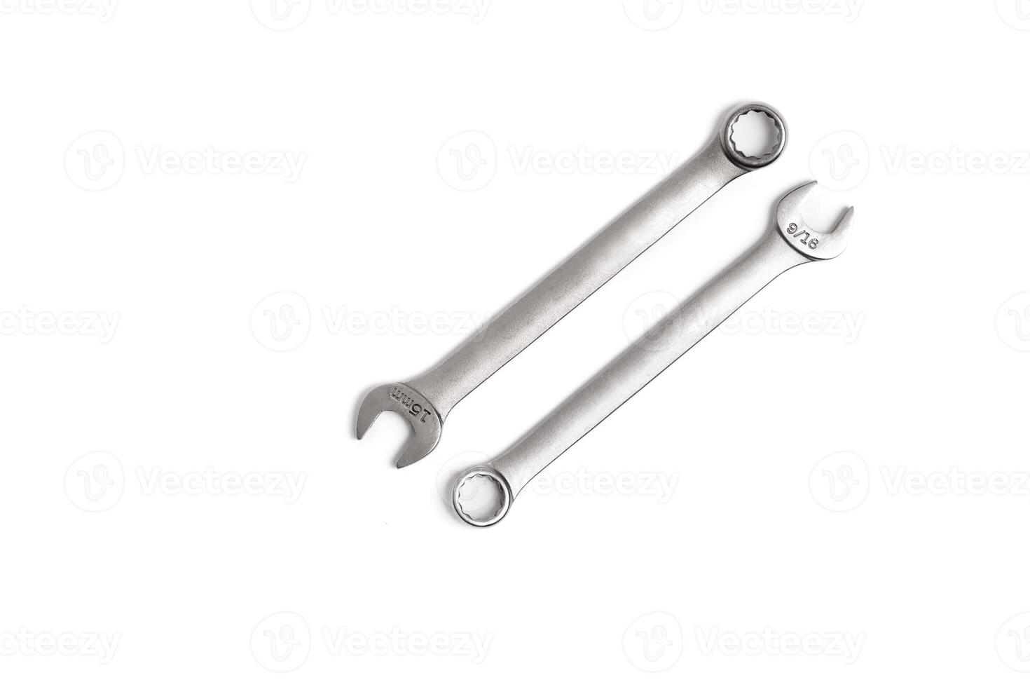Two Boxed and Open End Wrenches Lay Parallel and Inverse on White Background photo