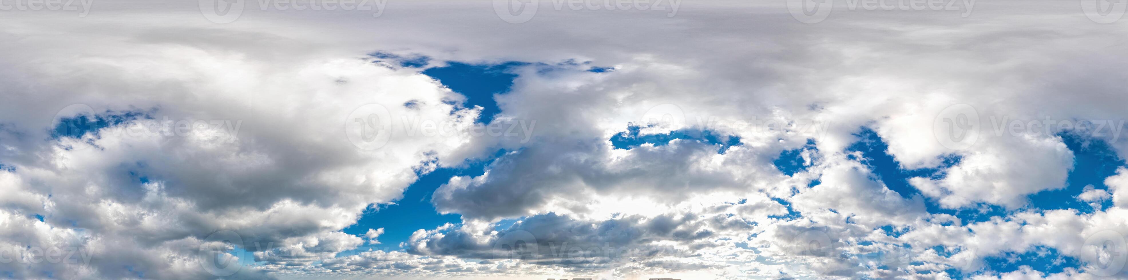 Seamless panorama of sky with puffy Cumulus clouds in spherical equirectangular format with complete zenith for use in 3D graphics, game and composites in aerial drone 360 degree panoramas as sky dome photo