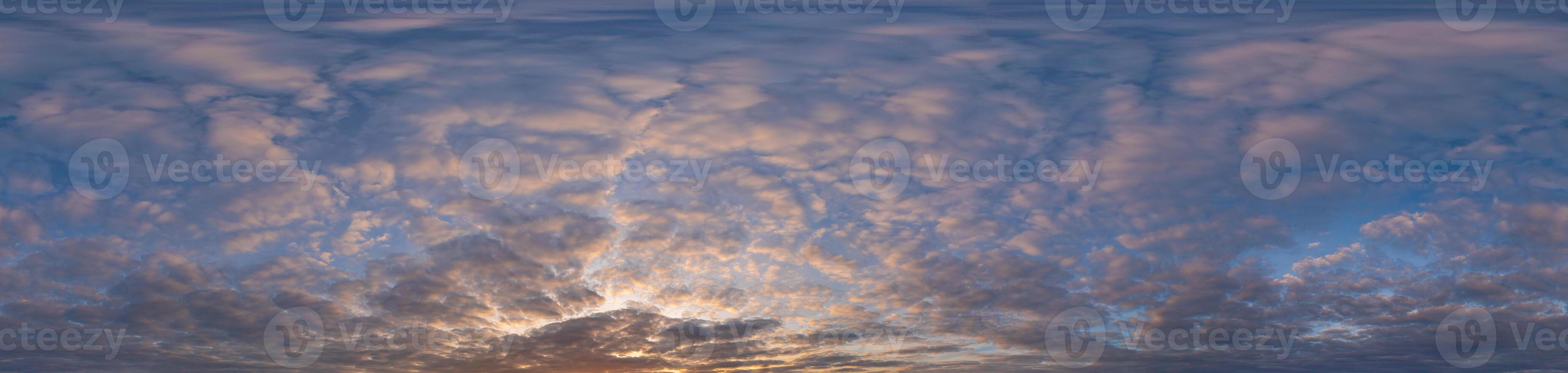 Golden sunset sky panorama Seamless spherical equirectangular 360-degree view with beautiful Stratocumulus clouds, setting sun - for use in 3D graphics as a sky dome or post-processing of drone images photo