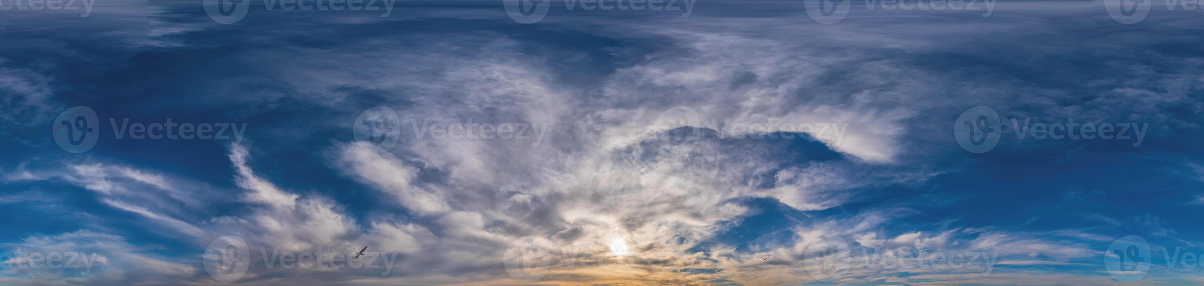 Sunset sky panorama with Cirrus clouds in Seamless spherical equirectangular format. Complete zenith for use in 3D graphics, game and for composites in aerial drone 360 degree panoramas as a sky dome photo